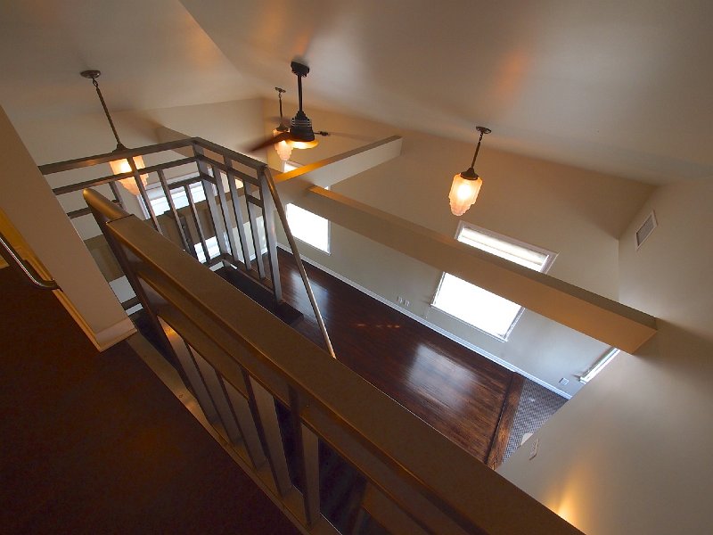 View of livingroom from loft showing of all the architectural detail